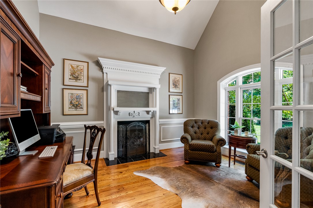 200 Graylyn Drive Anderson, SC 29621 - Photo 4 of 48 A refined home office with a stately fireplace and ample natural light, perfect for focused work.