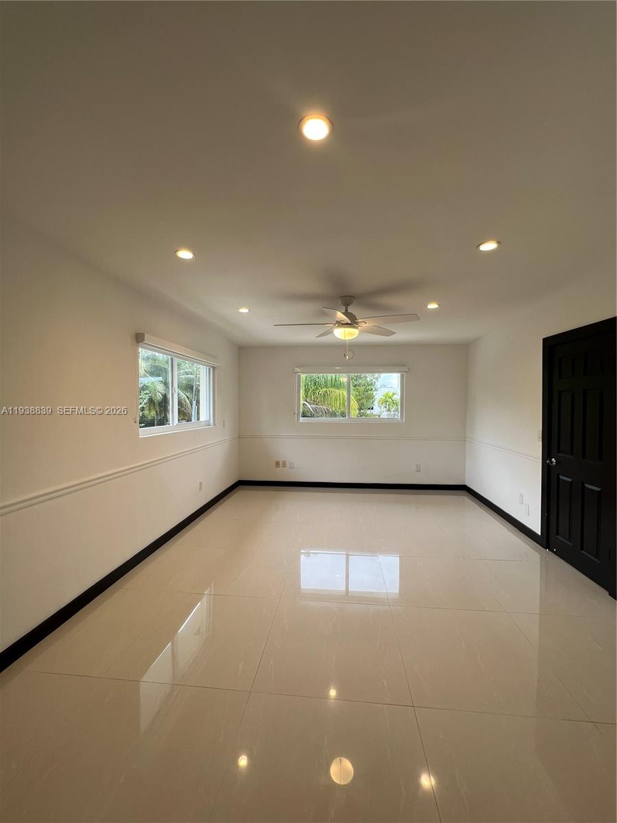 9210 Southwest 73rd Avrd, Unit 9210 Pinecrest, FL 33156 - Photo 13 of 18 a view of an empty room with a window