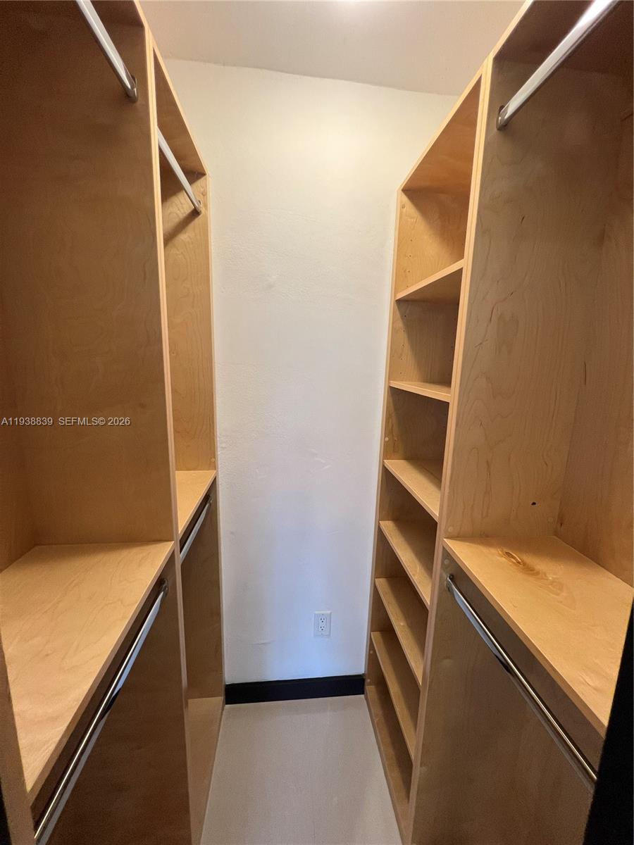9210 Southwest 73rd Avrd, Unit 9210 Pinecrest, FL 33156 - Photo 15 of 18 a view of an empty room and wooden floor
