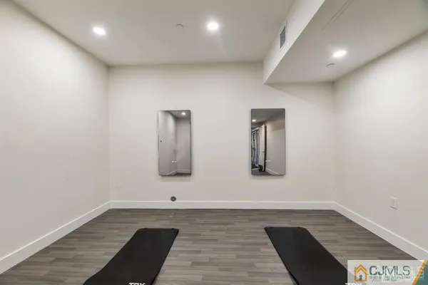 a large kitchen with stainless steel appliances a large counter top