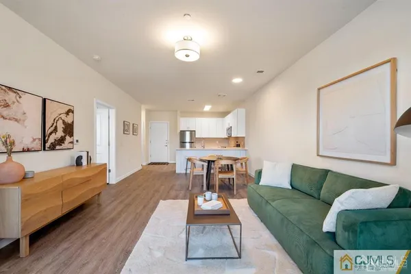 a bed sitting in a bedroom next to a bathroom