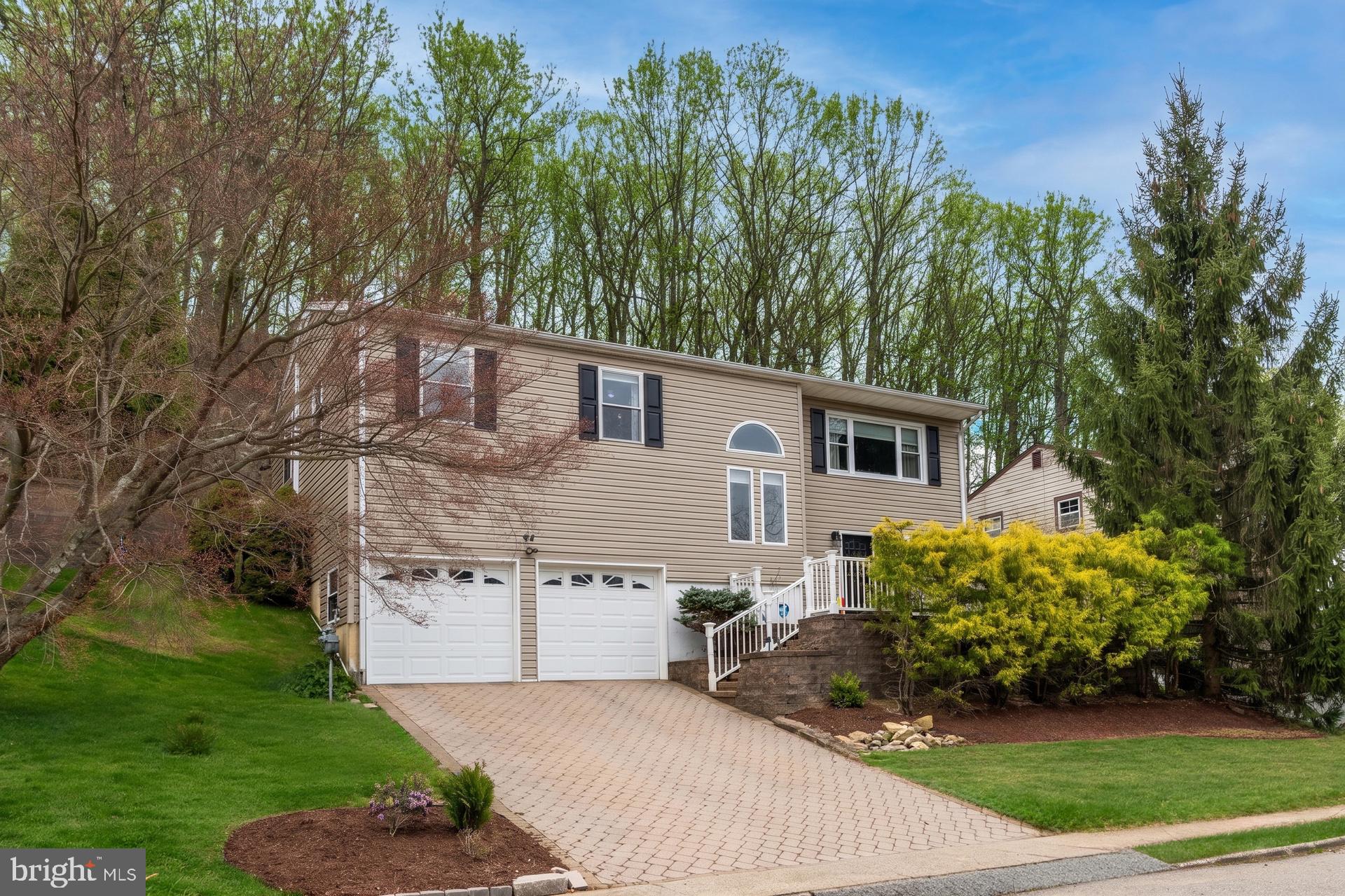 54 Highview Terrace Dover, NJ 07801 - Photo 2 of 32 Charming hillside home with lush greenery.