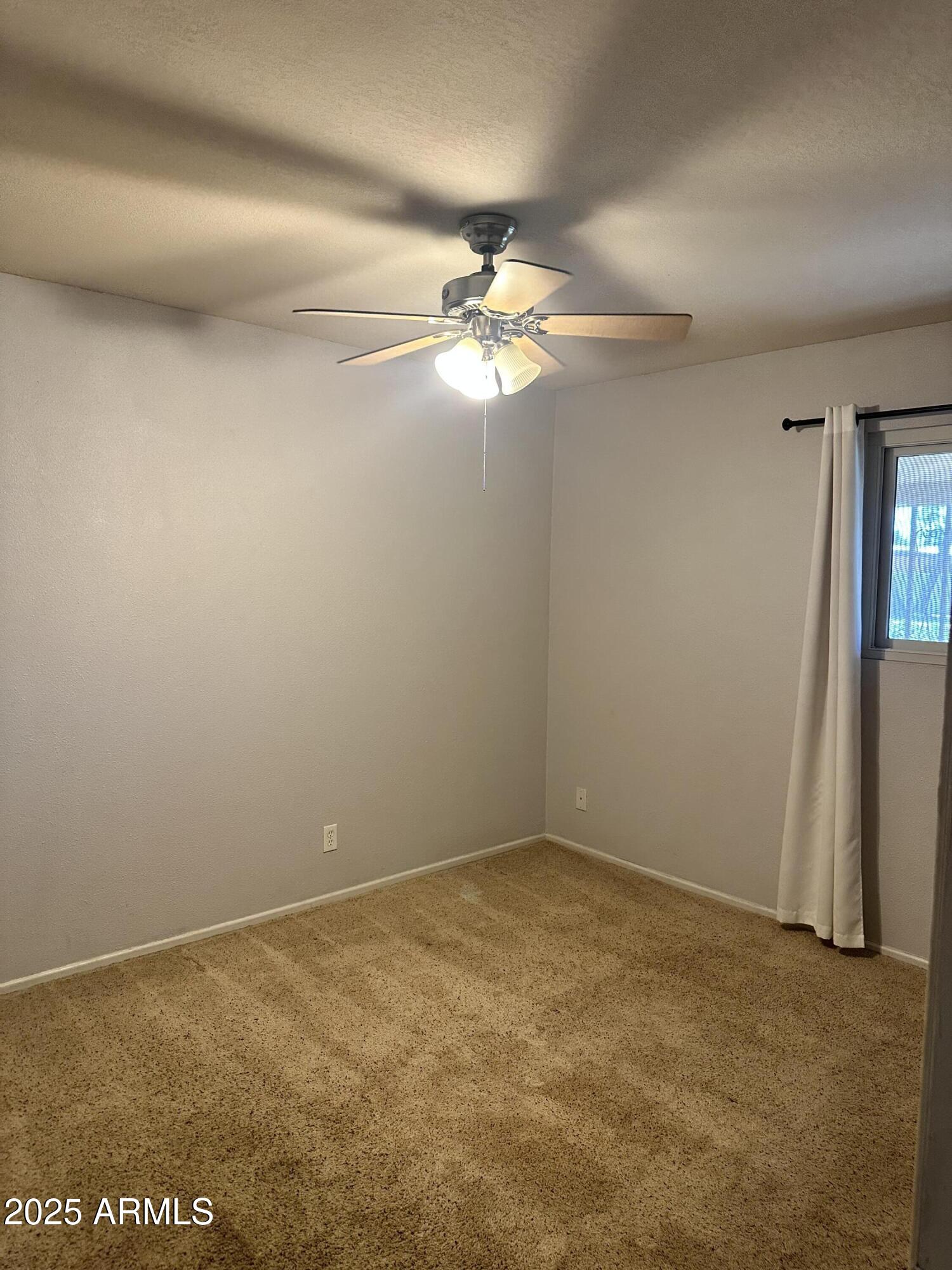 2525 South College Avenue, Unit 2 Tempe, AZ 85282 - Photo 1 of 13 a view of a big room with carpet