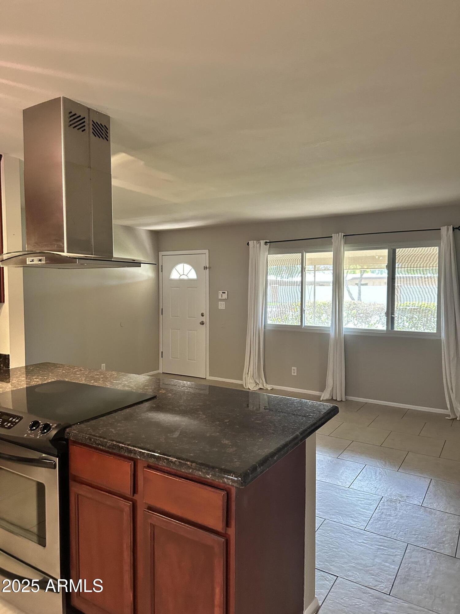 2525 South College Avenue, Unit 2 Tempe, AZ 85282 - Photo 7 of 13 a kitchen with granite countertop a sink and a stove