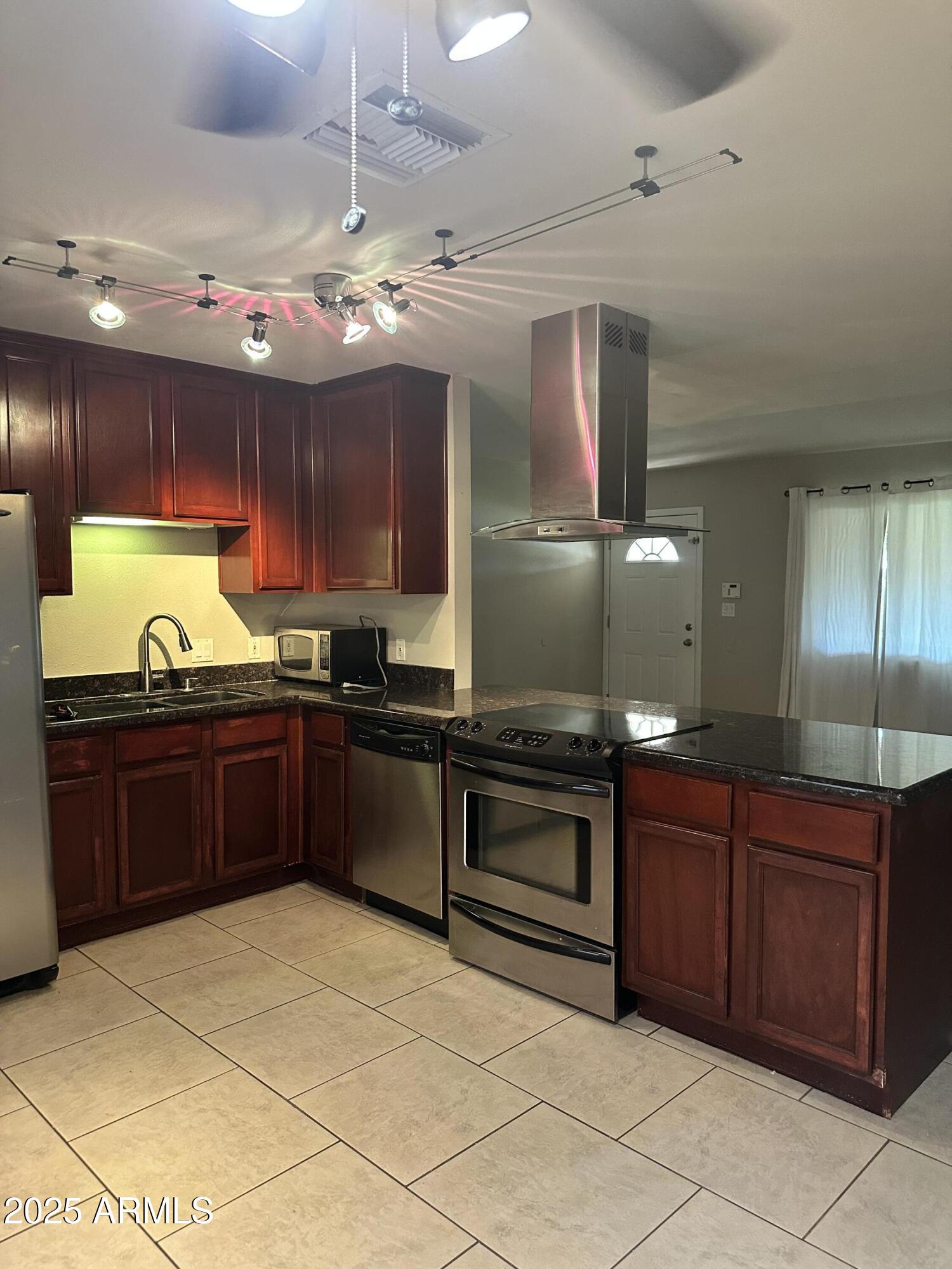 2525 South College Avenue, Unit 2 Tempe, AZ 85282 - Photo 10 of 13 a kitchen with a sink and cabinets