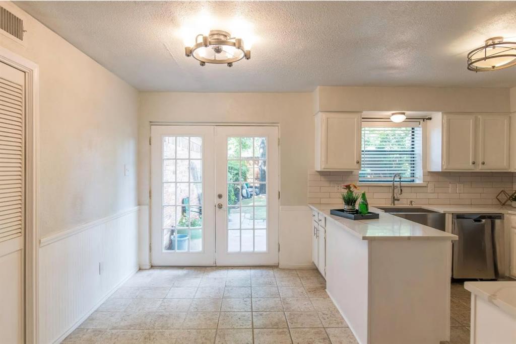4013 18th Street Plano, TX 75074 - Photo 14 of 39 a view of a kitchen and a window