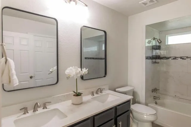 a view of a house with a backyard