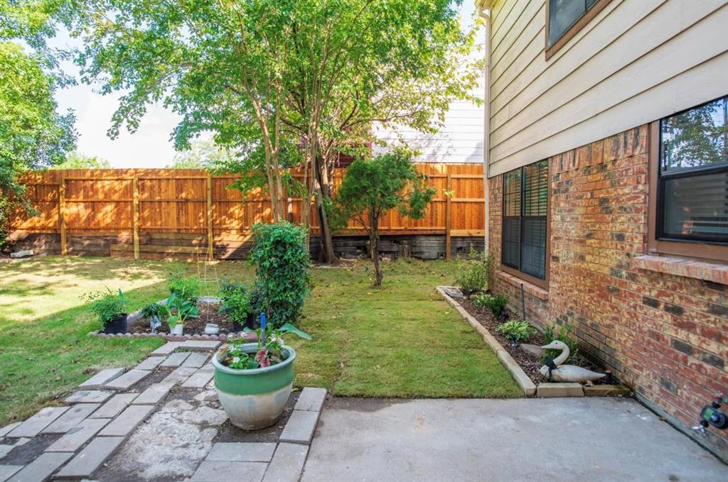 4013 18th Street Plano, TX 75074 - Photo 38 of 39 a backyard of a house with a garden and plants
