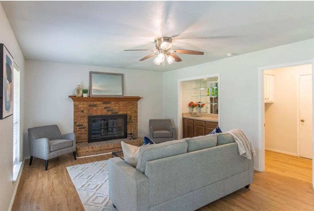 4013 18th Street Plano, TX 75074 - Photo 7 of 39 a living room with furniture and a fireplace