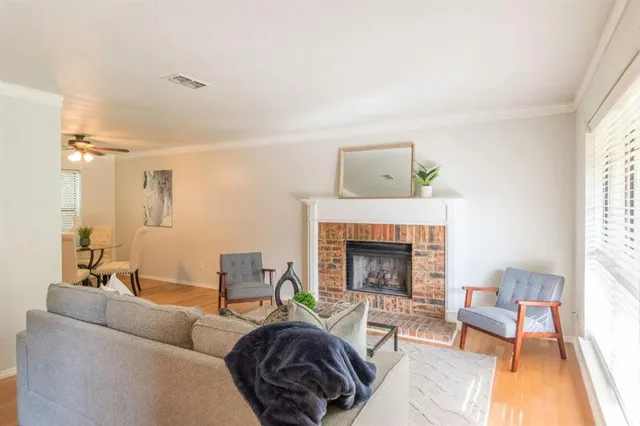 a view of a dining room with furniture and a window