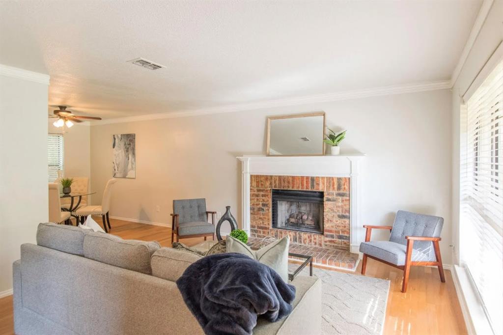 4013 18th Street Plano, TX 75074 - Photo 9 of 39 a living room with furniture and a fireplace