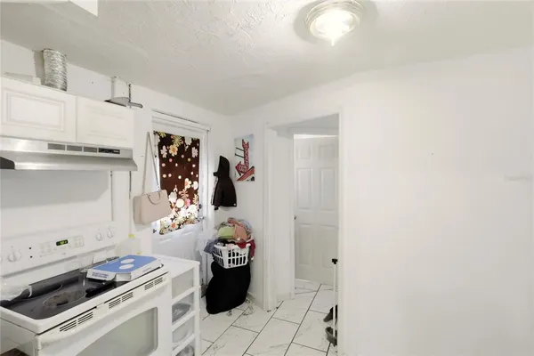 a kitchen with a stove and a refrigerator