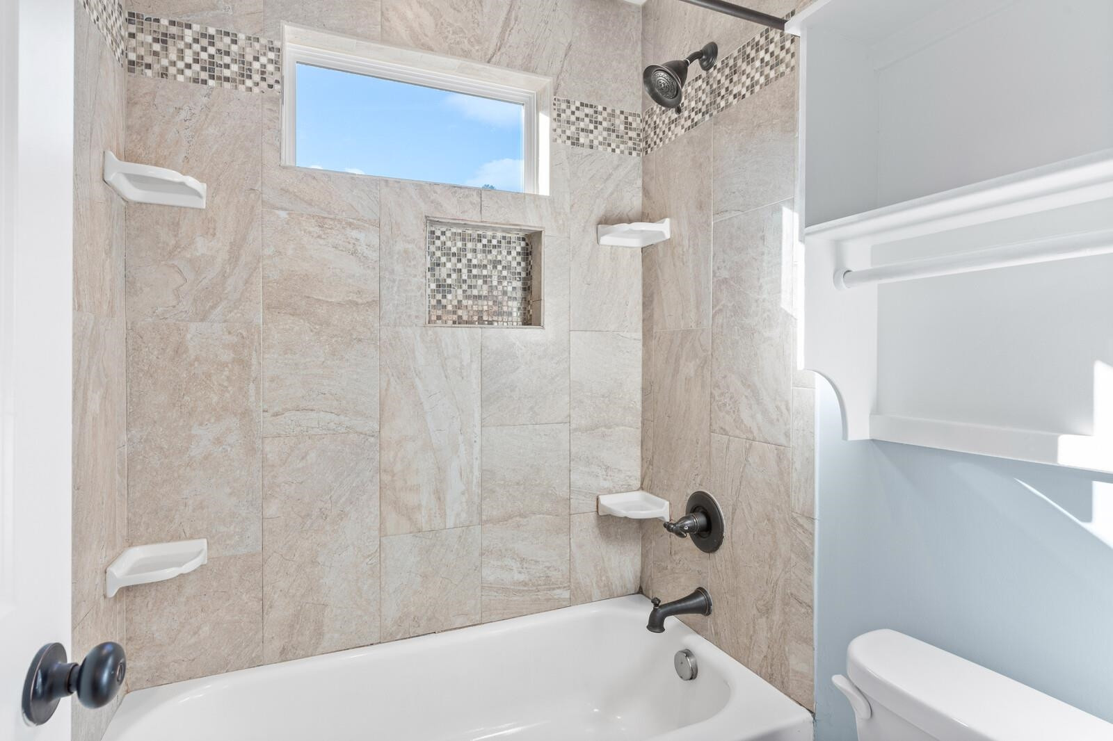 129 Pineland Circle, Unit 100 Raleigh, NC 27606 - Photo 14 of 29 a bathroom with a bathtub and shower