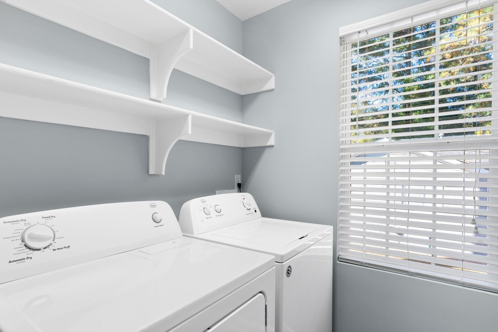 129 Pineland Circle, Unit 100 Raleigh, NC 27606 - Photo 16 of 29 a utility room with dryer and washer