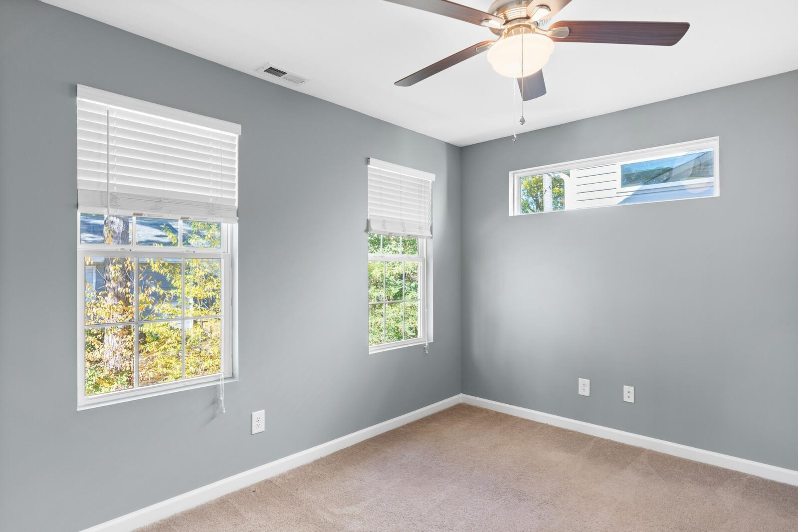 129 Pineland Circle, Unit 100 Raleigh, NC 27606 - Photo 28 of 29 a view of an empty room with a window