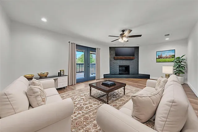 a living room with furniture fireplace and window