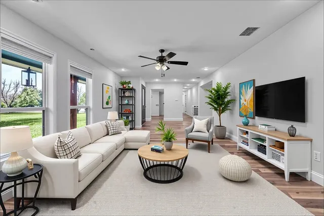 a living room with furniture and a flat screen tv