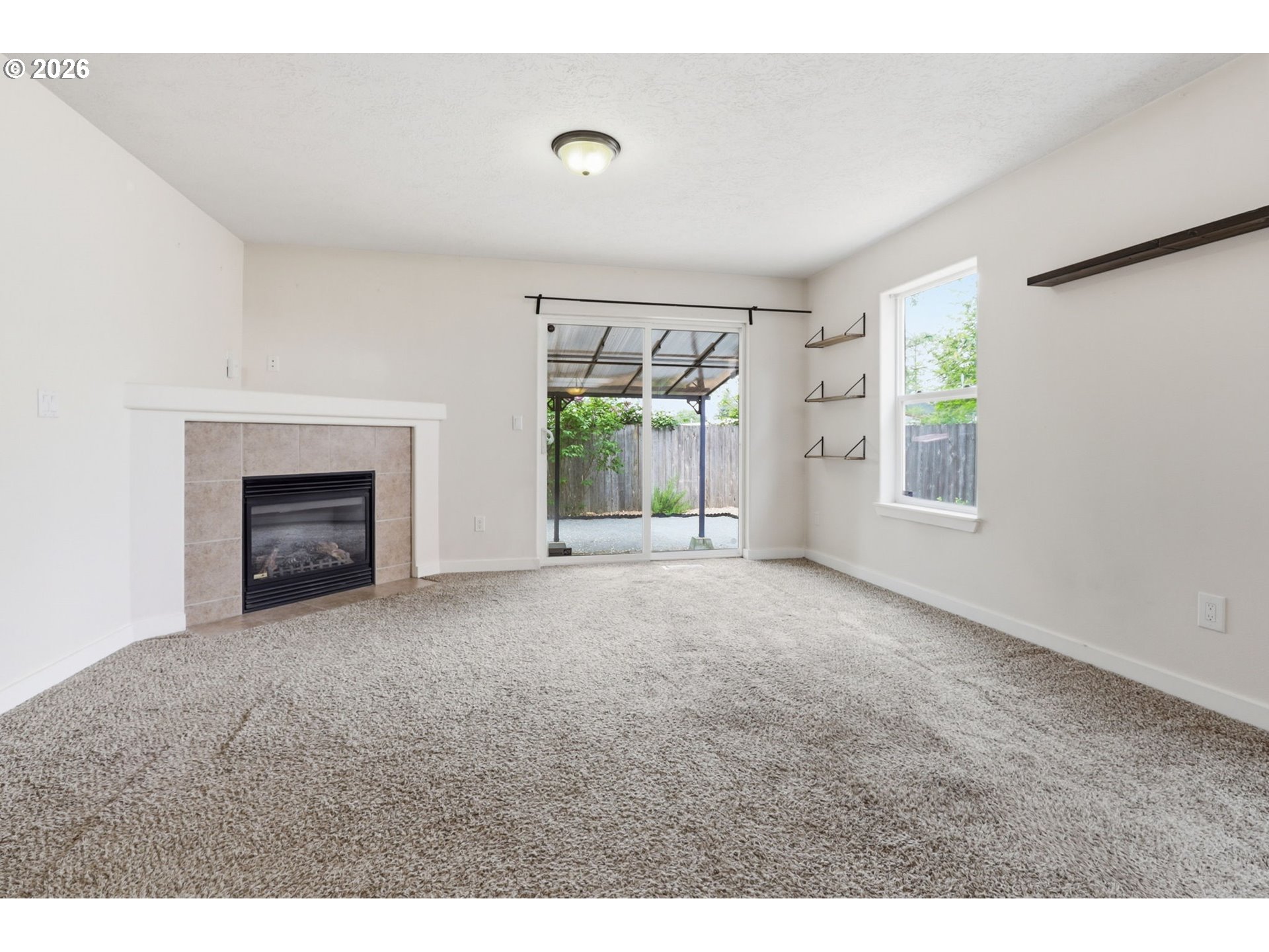 581 Southeast 204th Place Gresham, OR 97030 - Photo 12 of 32 a view of empty room with a fireplace