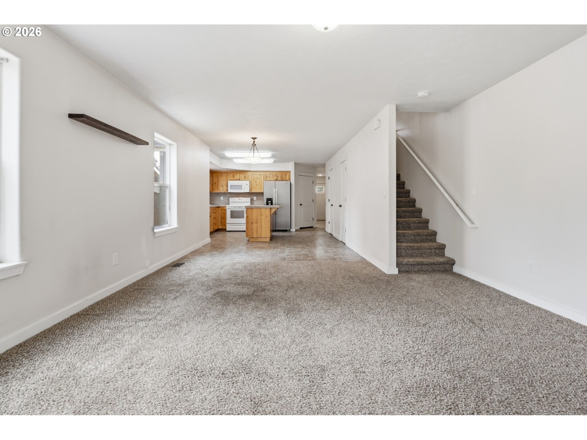 581 Southeast 204th Place Gresham, OR 97030 - Photo 13 of 32 a view of a livingroom with a staircase