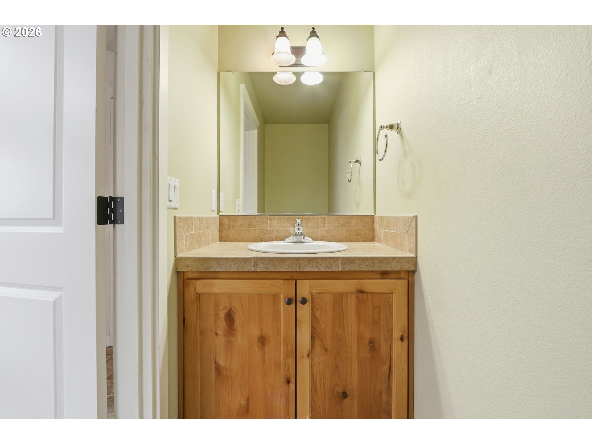 581 Southeast 204th Place Gresham, OR 97030 - Photo 14 of 32 a bathroom with a granite countertop sink and a mirror