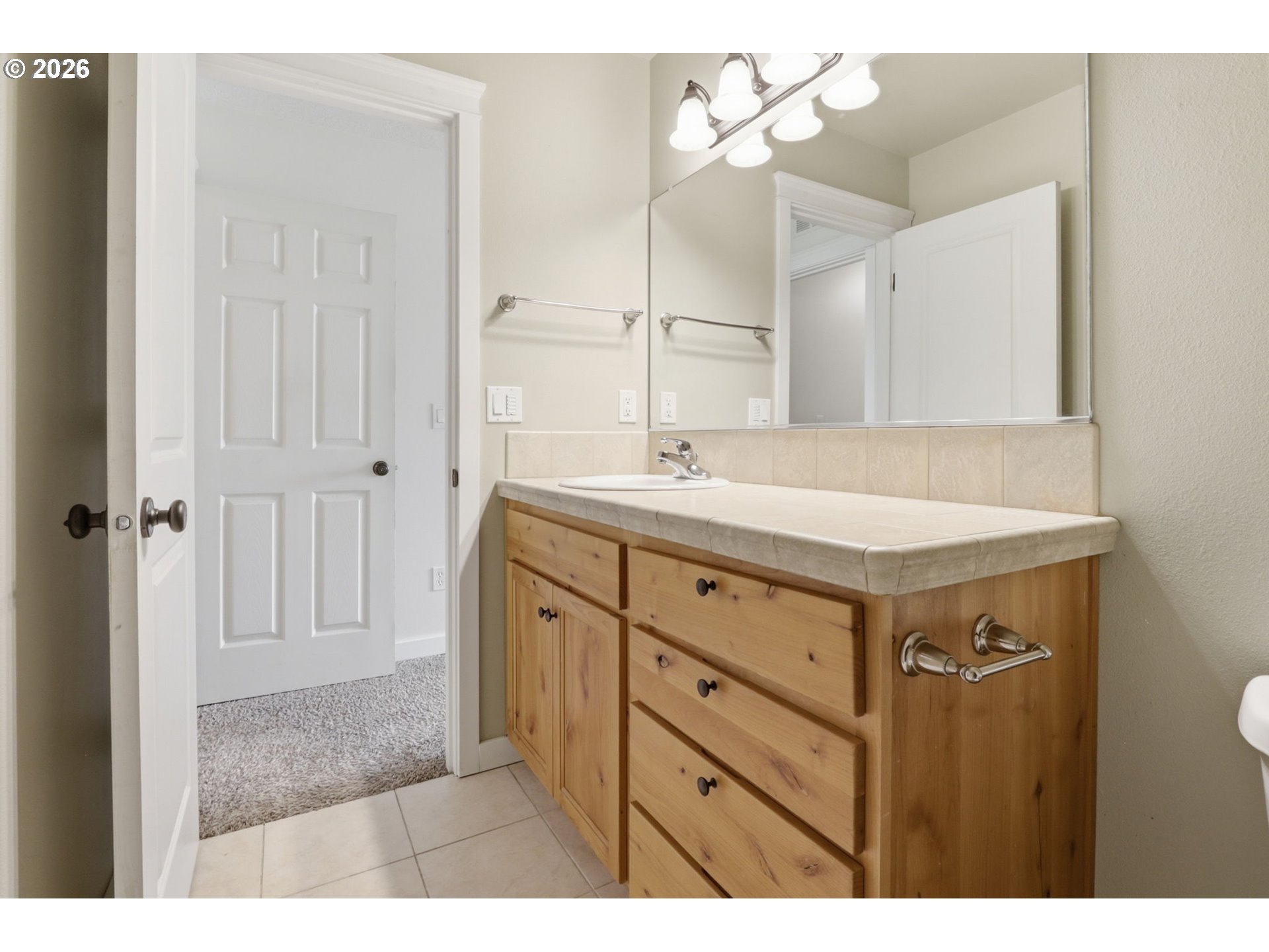 581 Southeast 204th Place Gresham, OR 97030 - Photo 18 of 32 a bathroom with a sink double vanity and a mirror