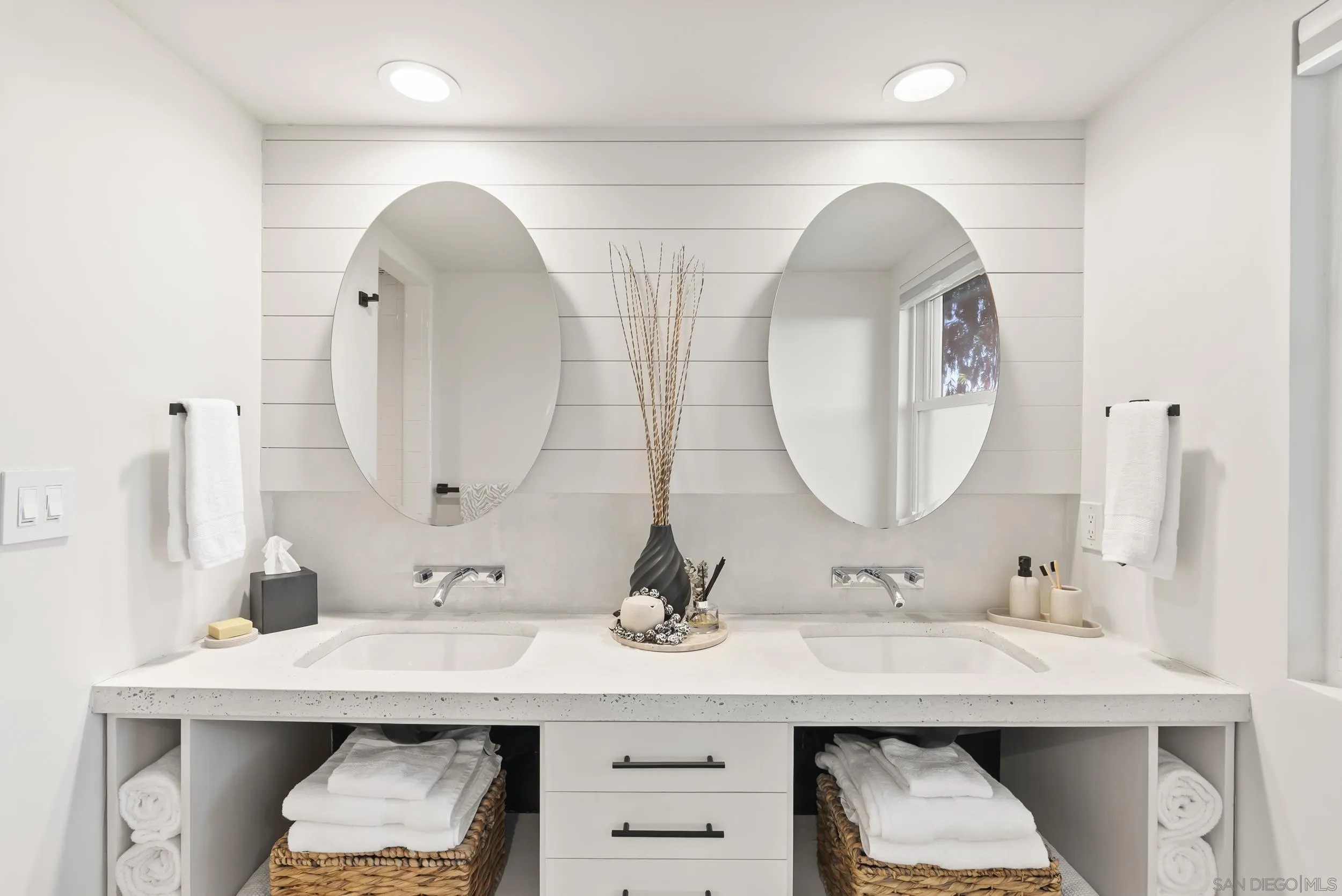 1873 Haymarket Road Encinitas, CA 92024 - Photo 7 of 16 a bathroom with double vanity sinks and a mirror