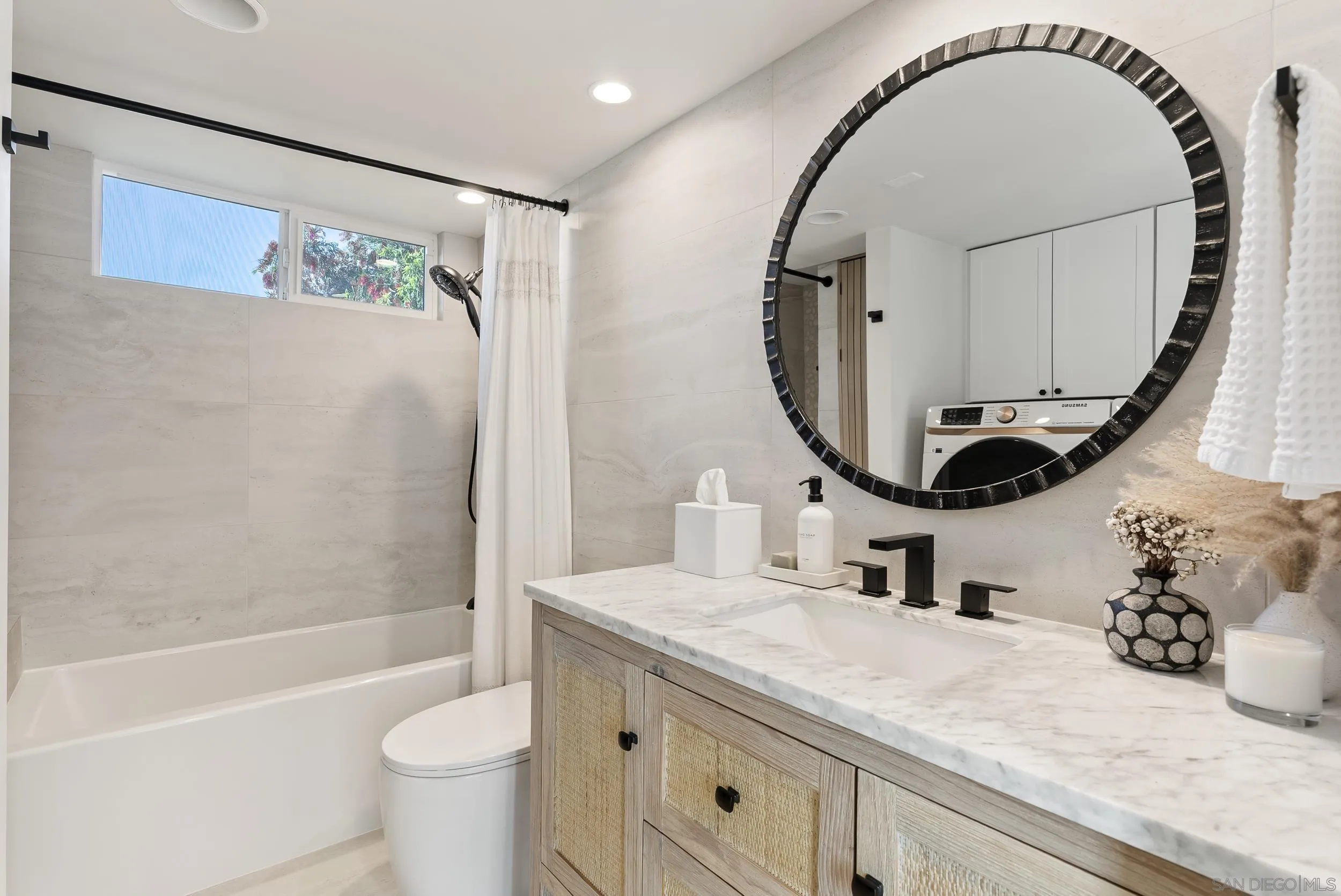 1873 Haymarket Road Encinitas, CA 92024 - Photo 9 of 16 a bathroom with a sink and a mirror