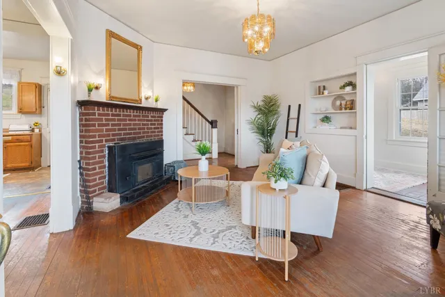 a kitchen with kitchen island a counter top space a sink stainless steel appliances and cabinets