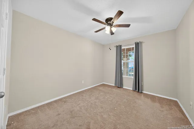 a view of a big room with wooden floor and closet in a room