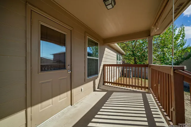 a view of balcony with wooden floor