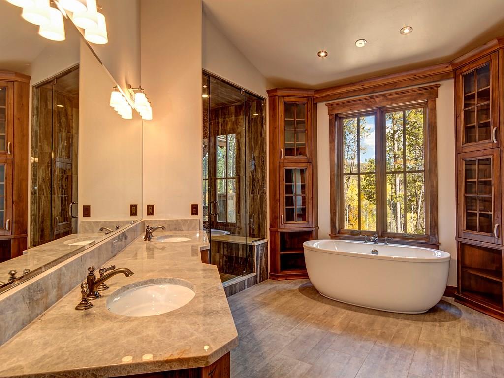 314 Peerless Drive Breckenridge, CO 80424 - Photo 8 of 25 a spacious bathroom with a double vanity sink and a mirror