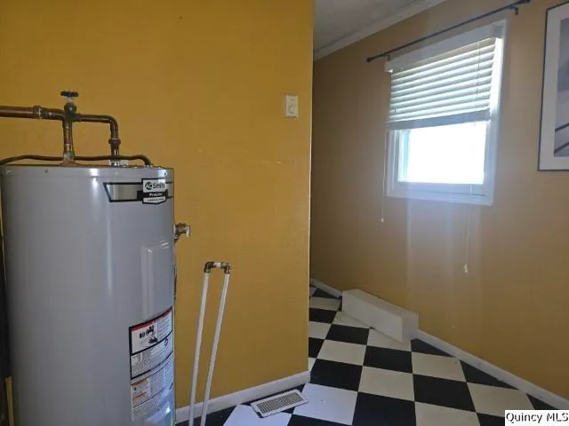 a view of a storage & utility room with a window