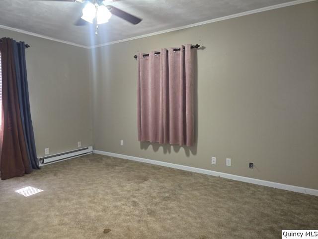 705 South Washington Street Carthage, IL 62321 - Photo 13 of 27 an empty room with a ceiling fan and a window