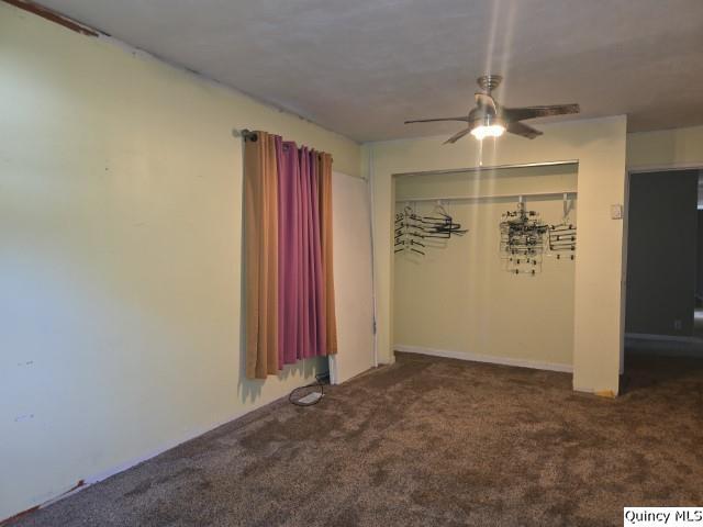 705 South Washington Street Carthage, IL 62321 - Photo 21 of 27 an empty room with closet and a chandelier fan