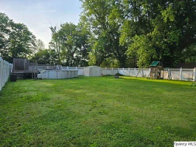 a view of a backyard with a garden