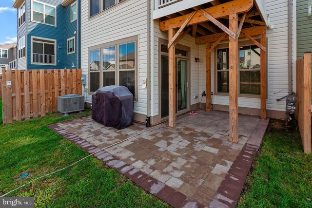 a view of a house with backyard and porch