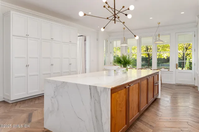a bathroom with a sink and a large mirror