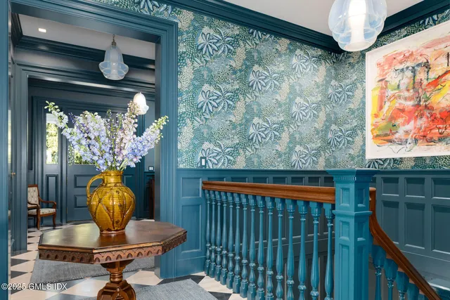 a balcony view with a garden and outdoor seating