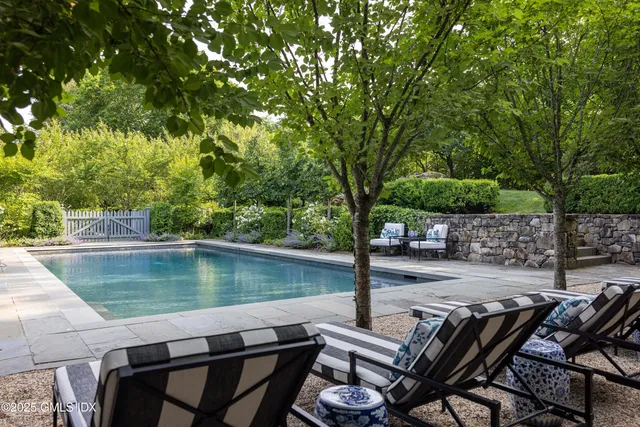 a view of a chairs and table on the deck