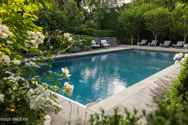 a view of a lake with a house in the background