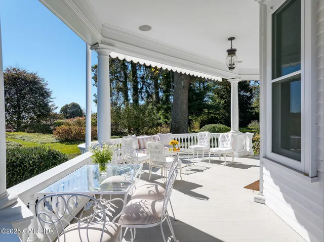 a view of a patio with a dining table and chairs