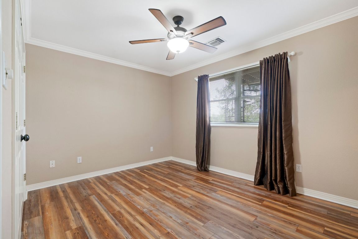 1237 Ridge Harbor Drive Spicewood, TX 78669 - Photo 22 of 40 wooden floor in an empty room with a window