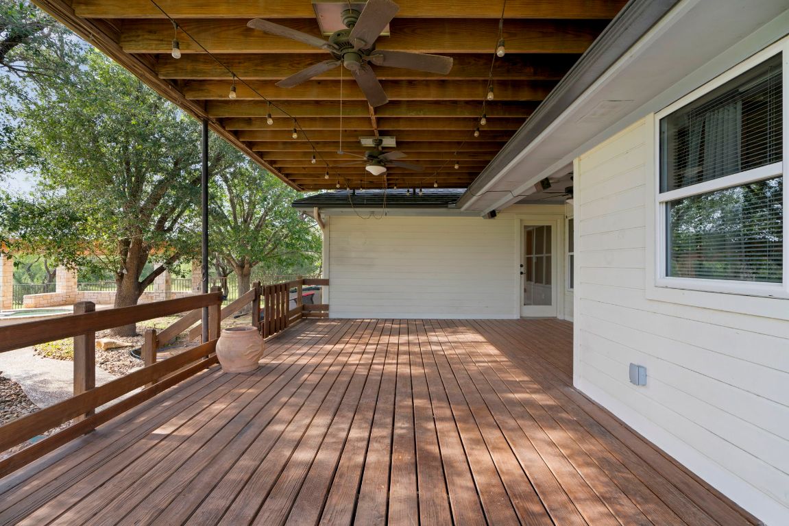 1237 Ridge Harbor Drive Spicewood, TX 78669 - Photo 30 of 40 a view of backyard with wooden floor and brick walls