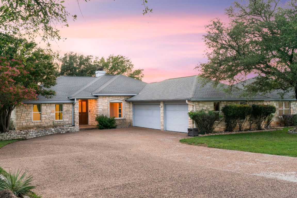 1237 Ridge Harbor Drive Spicewood, TX 78669 - Photo 8 of 40 front view of a house with a yard