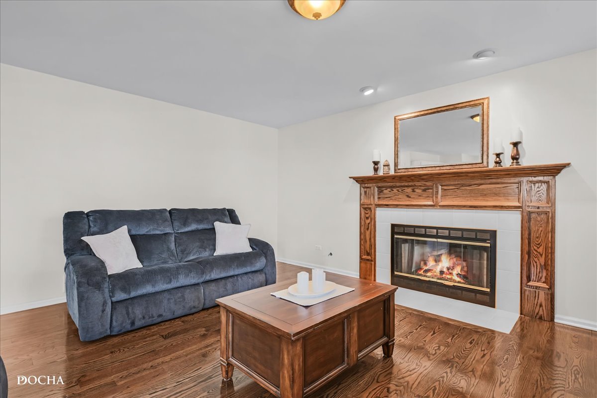 4301 Anthony Lane Plainfield, IL 60586 - Photo 11 of 31 a living room with furniture and a fireplace
