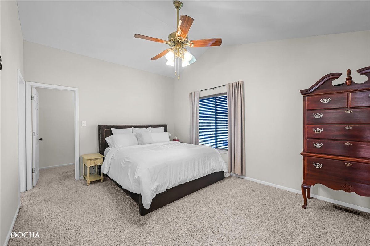 4301 Anthony Lane Plainfield, IL 60586 - Photo 16 of 31 a bedroom with a bed and a chandelier