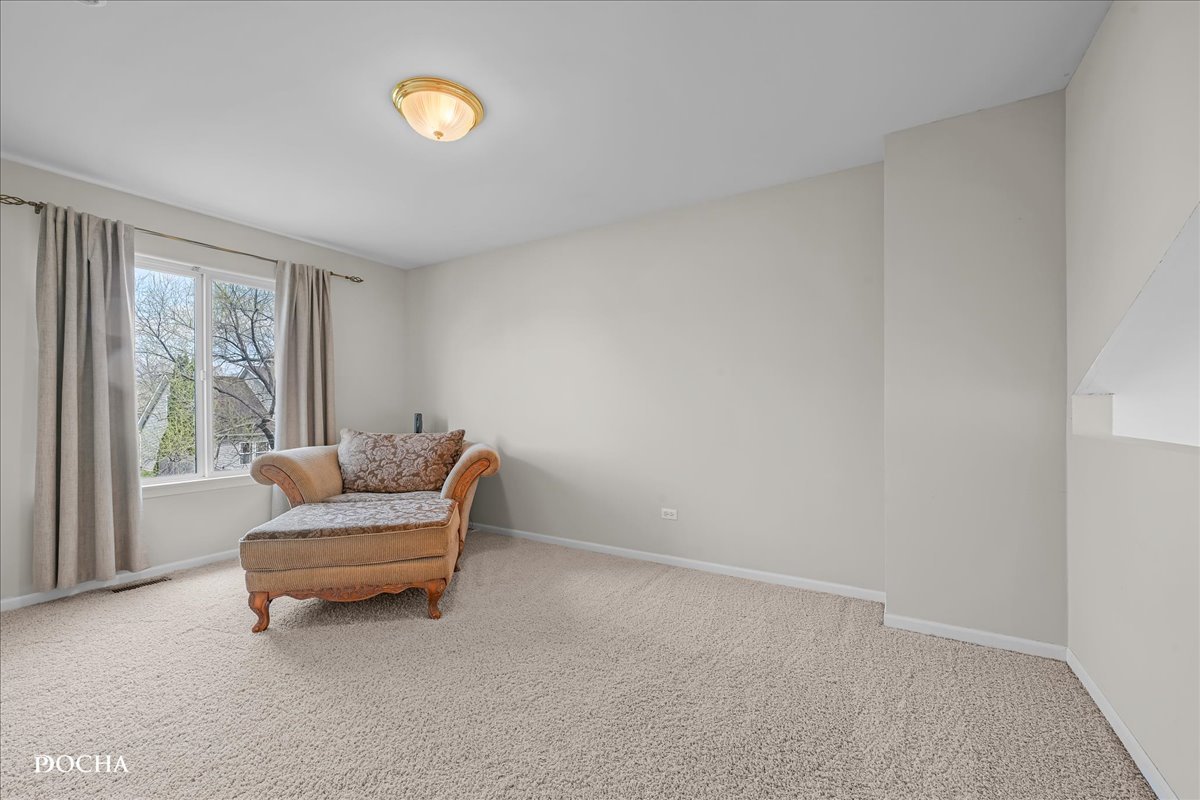 4301 Anthony Lane Plainfield, IL 60586 - Photo 18 of 31 a living room with furniture and a window