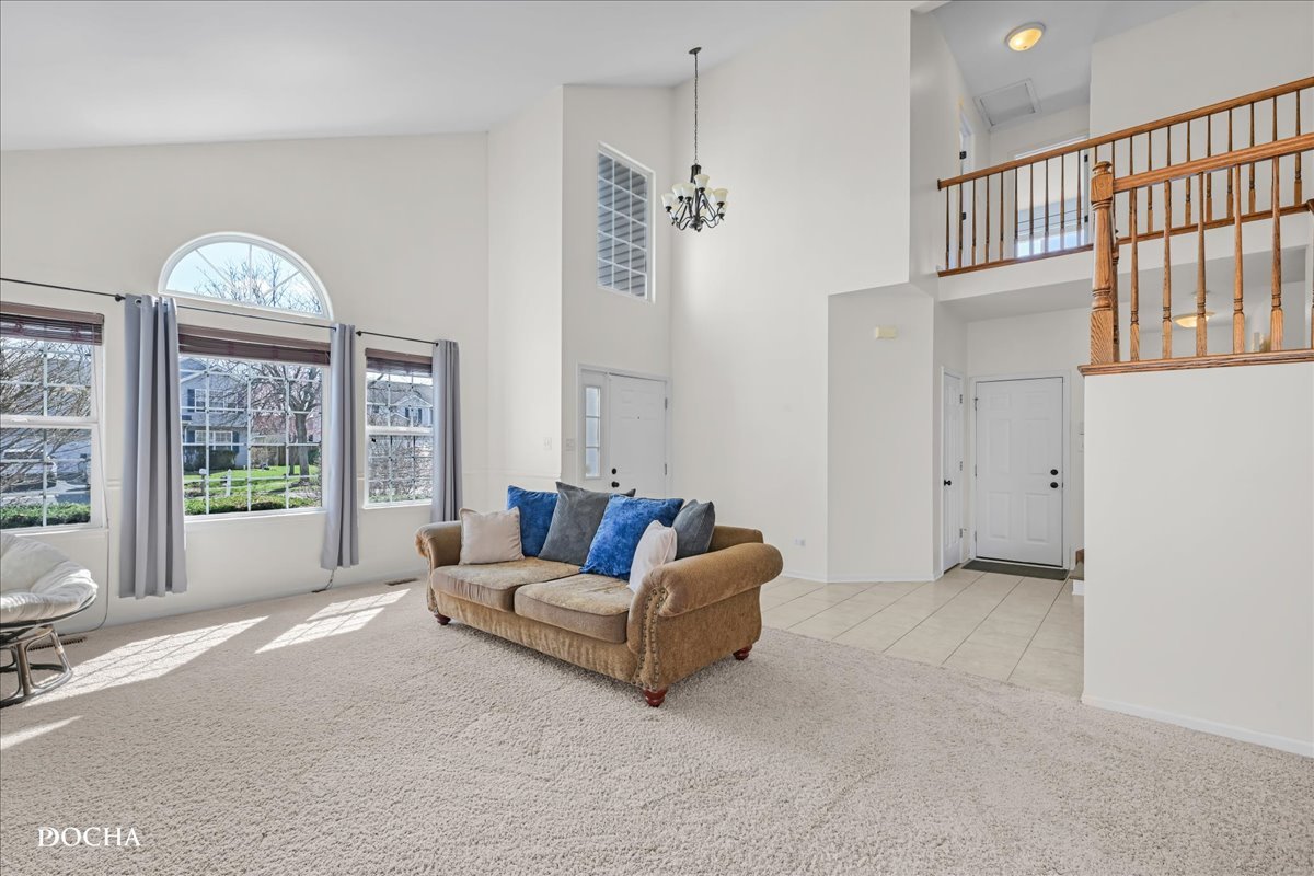 4301 Anthony Lane Plainfield, IL 60586 - Photo 2 of 31 a living room with furniture and a large window
