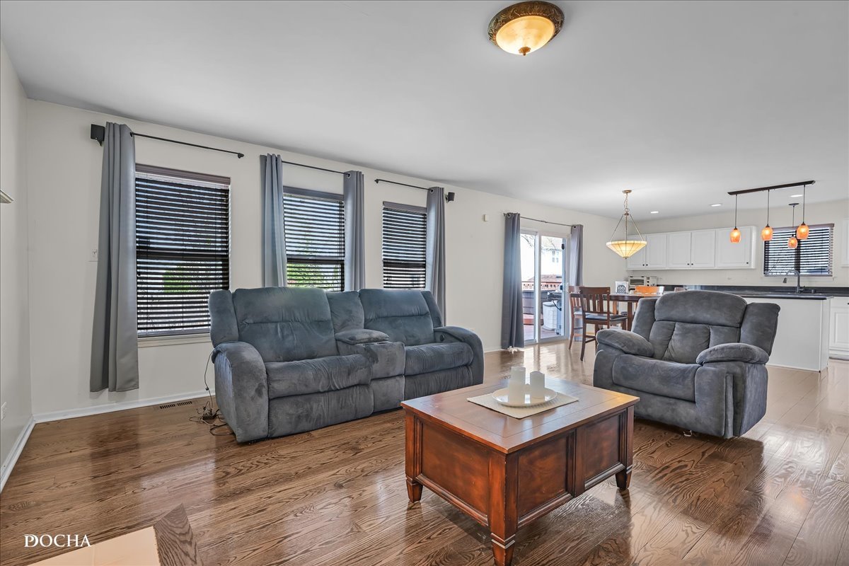 4301 Anthony Lane Plainfield, IL 60586 - Photo 10 of 31 a living room with furniture and a window