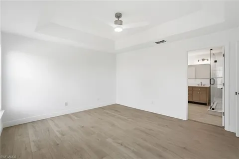a bathroom with a double vanity sink mirror and shower